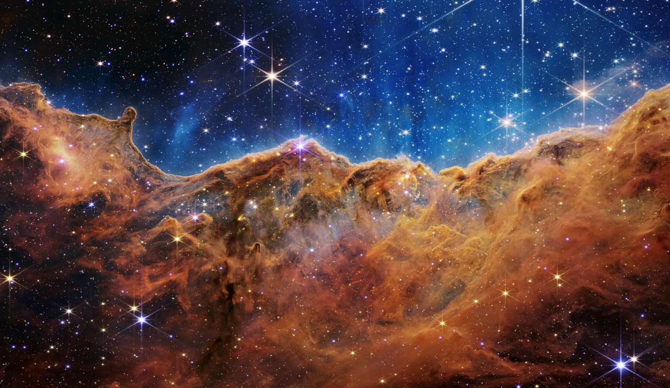 00 nasas-webb-reveals-cosmic-cliffs-glittering-landscape-of-star-birth_52211883534_o.png