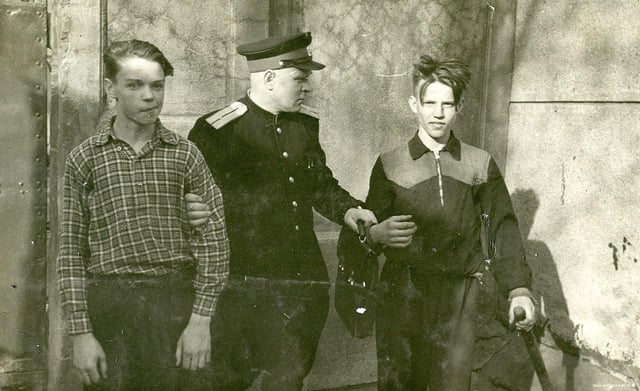 a-soviet-militsioner-policeman-escorts-two-teenage-v0-t944w879hodf1.jpeg