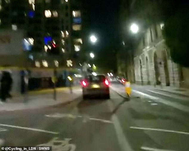 Moment-car-drives-along-busy-two-way-cycle-lane-during-rush.jpg