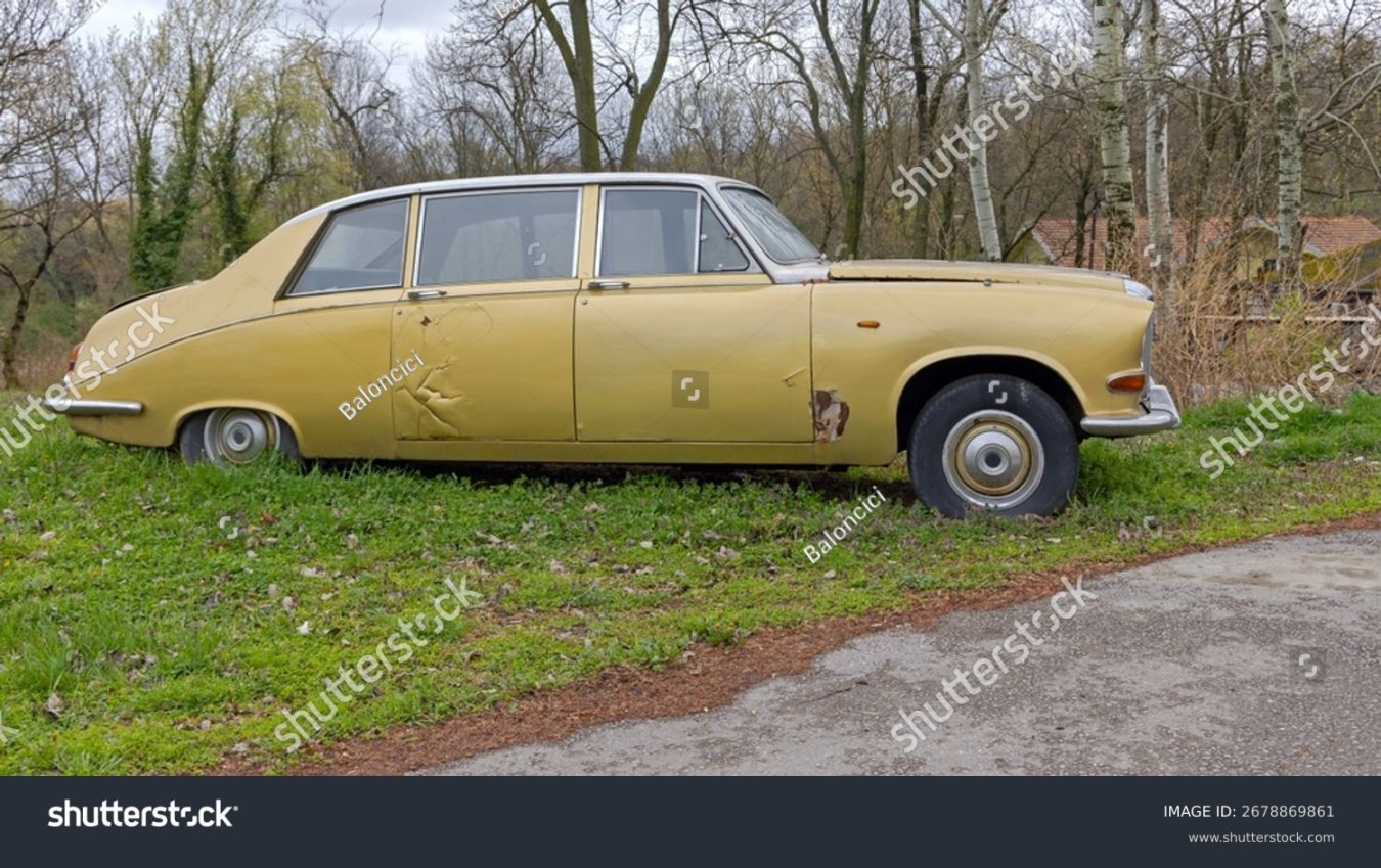 stock-photo-gold-colour-classic-car-limousine-heritage-abandoned-parked-at-grass-in-pozarevac-...jpg