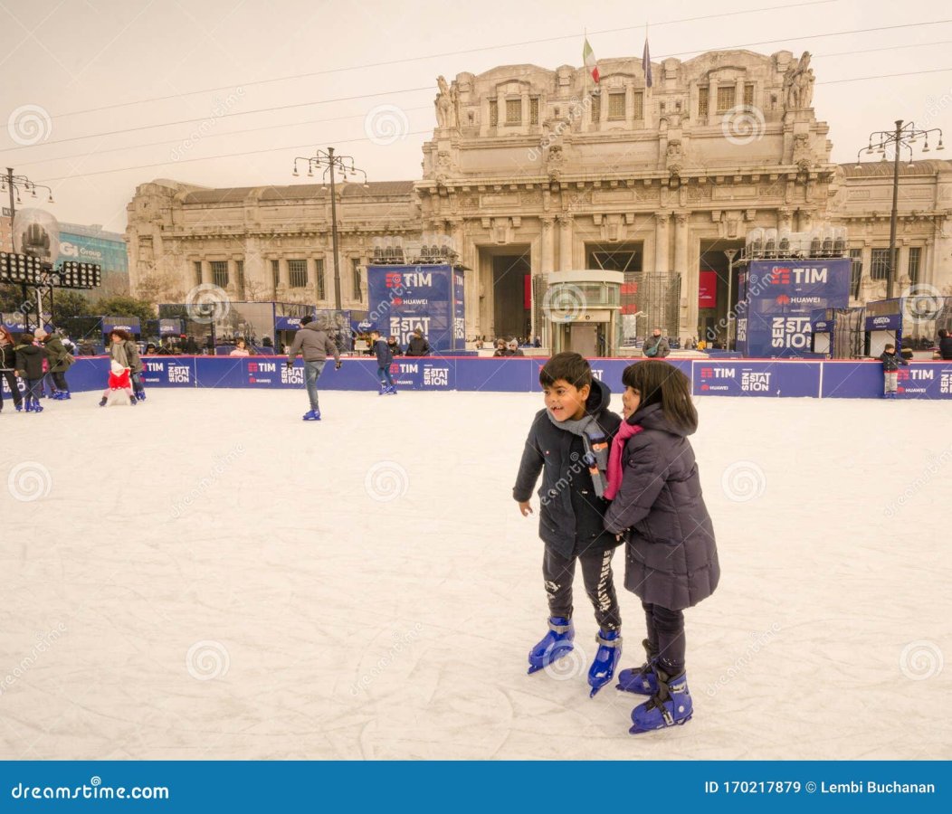 two-young-children-trying-out-their-skates-ice-rink-front-milan-train-station-milan-italy-dece...jpg